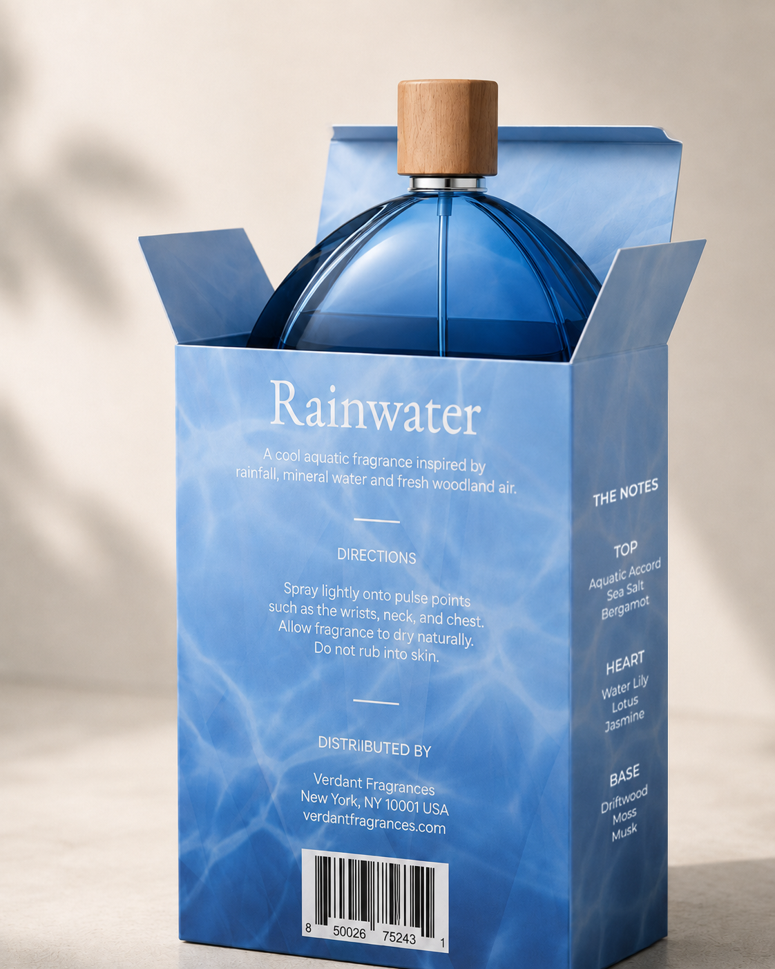 Verdant Rainwater 200 mL bottle emerging from an open folding carton